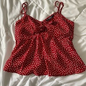 A red with white leaves top that ties.